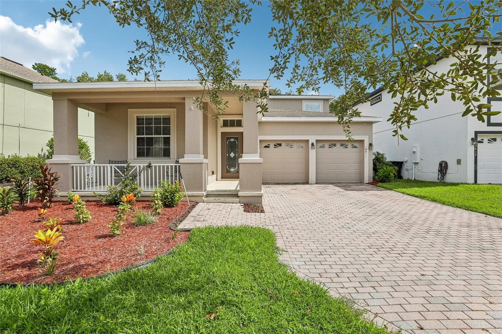 Set on a CONSERVATION LOT with peaceful WOODED VIEWS, this spacious two-story home offers 5 bedrooms, 3.5 baths, a desirable MAIN-FLOOR PRIMARY SUITE and a FULLY FENCED BACKYARD in the sought-after EAST PARK community of Lake Nona! — 10411 Kristen Park Drive, Orlando, Florida